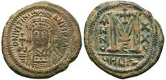 Byzantine Coins JUSTINIAN I (527-565). Follis. Antioch. Obv: D N IVSTINIANVS P P AVG. Helmeted and cuirassed bust facing, holding globus cruciger and shield decorated with horseman motif. Rev: Large M