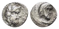 GREEK COINS CILICIA. Nagidos.(Circa 400-380 BC).Obol. EX BIGA. Condition : The coin is in a worn condition, with some details on the obverse and reverse being faint or eroded. The surface shows a silv