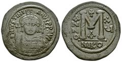 BYZANTINE COINS JUSTINIAN I.(527-565).Cyzikos.Follis. Obv : D N IVSTINIANVS P P AVG. Helmeted and cuirassed bust facing, holding globus cruciger and shield; cross to right. Rev : Large M between ANNO 