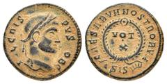 Roman Imperial Coins CRISPUS.(316-326).Siscia.Follis. Obv : IVL CRISPVS NOB C. Laureate head right. Rev : CAESARVM NOSTRORVM ASIS. VOT X within wreath. RIC 181. Condition : Reddish-brown patina with e