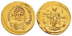 Byzantine Coins JUSTINIAN I.(527-565).Constantinople.Solidus. Obv : D N IVSTINIANVS P P AVG. Helmeted and cuirassed bust facing, holding globus cruciger and shield decorated with horseman motif. Rev :