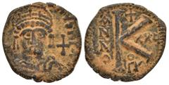 Byzantine Coins JUSTINIAN I.(527-565).Antioch.Half Follis. Obv : D N IVSTINIANVS P P AVG. Helmeted and cuirassed bust of Justinian I facing, holding globus cruciger and shield, cross to right. Rev : L