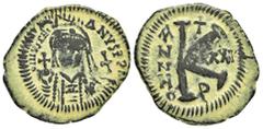 Byzantine Coins JUSTINIAN I.(527-565).Theoupolis (Antioch).Half Follis. Obv : DN IVSTINIANVS PP AVG. Helmeted, cuirassed bust facing, holding cross on globe and long sceptre, cross to right. Rev : Lar