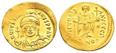Byzantine Coins JUSTINIAN I.(527-565).Constantinople.Solidus. Obv : D N IVSTINIANVS P P AVG. Helmeted and cuirassed bust facing, holding globus cruciger and shield decorated with horseman motif. Rev :