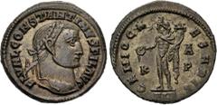 Roman Imperial Constantine I. As Filius Augustorum, AD 309-310. Æ Follis (23mm, 6.19 g, 6h). Alexandria mint, 1st officina. Laureate head right / Genius standing left, holding patera, from which liquo