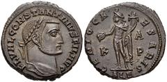 Constantine I. As Filius Augustorum, AD 309-310. Æ Follis (23mm, 7.61 g, 11h). Alexandria mint. Struck AD 309-310. FL VAL CONSTANTINVS FIL AVG, laureate head right / Genius standing facing, head left,