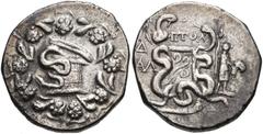 LYDIA, Tralleis. Circa 166-67 BC. AR Tetradrachm (23mm, 12.33 g, 12h). Cistophoric type. Ptol-, magistrate. Dated CY 4 (130 BC). Cista mystica with serpent; all within ivy wreath / Two serpents entwin