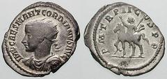 GORDIAN III Estimate $750 GORDIAN III. 238-244 AD. AR Antoninianus (4.57 gm). Antioch mint. IMP CAES M ANT GORDIANVS AVG, radiate, draped and cuirassed bust left, seen from the front / P M TR P II COS