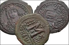 BYZANTINE. Lot of three (3) Æ Folles from Tiberius Constantine to Maurice Tiberius. Includes: Tiberius Constantine. Æ Follis. Theoupolis (Antioch) mint. Dated RY 8 // Maurice Tiberius. Æ Follis Theoup