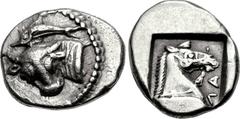 THESSALY, Larissa. Late second quarter of the 5th century BC. AR Obol (12mm, 1.21 g, 10h). Head and neck of bull l., the head turned to face the viewer, above, dolphin r., all in a dotted circle / ΛΑ 