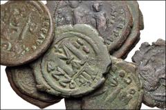 BYZANTINE. Lot of ten (10) Æ Folles and Half Folles from Maurice Tiberius to Heraclius. Includes: Maurice Tiberius. Æ Follis // Phocas. Æ Half Follis (2) // Heraclius and Heraclius Constantine. Æ Foll