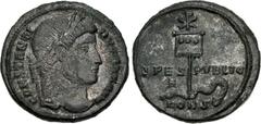 Roman Imperial Constantine I. AD 307/310-337. Æ Follis (19mm, 3.46 g, 12h). Constantinople mint, 1st officina. Struck AD 327. Laureate head right / Labarum surmounted by Christogram, with three medall
