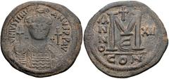 Justinian I. 527-565. Æ Follis (40mm, 21.64 g, 7h). Constantinople mint, 5th officina. Dated RY 12 (AD 538/9). Helmeted and cuirassed bust facing, holding globus cruciger and shield; cross to right / 
