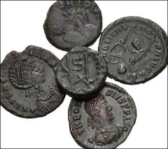 ROMAN. Imperial. Lot of five (5) bronze coins from Theodosius II to Honorius. Includes: Theodosius II // Aelia Flacilla (2) // Honorius. Lot also includes an uncertain nummus. Average Fine. LOT SOLD A