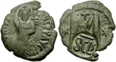 189843. Sold For $75 HERACLIUS. 610-641 AD. Æ Follis (34mm, 7.55 gm). Sicilian mint. Struck 616-620 AD. Countermarked on a follis of Justin I: crowned, draped, and cuirassed facing bust of Heraclius w