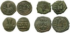 BYZANTINE. Early Empire. Lot of four Æ. Lot includes the following: JUSTIN II. 565-578 AD. Æ Follis. Nicomedia mint. SB 369 // Same. SB 1007 // MAURICE TIBERIUS. 582-602 AD. Æ Follis. Nicomedia mint. 