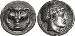 BRUTTIUM, Rhegion. Circa 415/0-387 BC. AR Tetradrachm (25mm, 16.79 g, 9h). Facing head of lion / Head of Apollo right, wearing laurel wreath; olive sprig to left, PHΓIИOИ to right. Herzfelder 75 (D43/