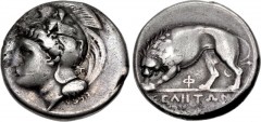LUCANIA, Velia. Circa 334-300 BC. AR Nomos (20mm, 7.31 g, 8h). Kleudoros group. Helmeted head of Athena left, helmet decorated with sphinx; monogram behind neck guard / Lion standing left, tearing at 