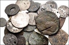 MIXED. Roman-Byzantine. Lot of thirty (30) silver and bronze coins altered in antiqutiy. Includes coins altered by piercing, smoothing, hammering, cutting, gilding, and clipping. Of particular interes