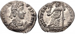 Honorius. AD 393-423. AR Siliqua (17mm, 1.34 g, 12h). Mediolanum (Milan) mint. Struck AD 394-395. Pearl-diademed, draped, and cuirassed bust right / Roma seated left on cuirass, holding crowning Victo
