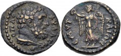 IONIA, Smyrna. Pseudo-autonomous issue. Circa 180-200 AD. Æ (17mm, 3.69 g, 6h). Head of Hercules-Hoplophylax right, with lion’s skin tied around neck / Nike advancing left, holding wreath and palm fro