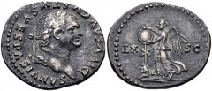 Divus Vespasian. Died AD 79. AR Denarius (20mm, 2.97 g, 6h). “Judaea Capta” commemorative. Rome mint. Struck under Titus, AD 80-81. Laureate head right / Victory advancing left, placing shield on trop
