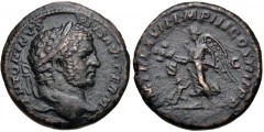 Caracalla. AD 198-217. Æ As (25mm, 9.89 g, 12h). British Victory type. Rome mint. Struck AD 214. Laureate head right / Victory standing left, holding trophy in both hands; at feet to left, suppliant f