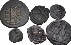 BYZANTINE. Early Empire. Lot of twelve (12) Æ denominations. Includes: Mostly issues of Justinian I, including two folles, four half folles and two decanummium issues (8 coins total). Lot also include