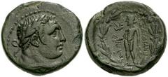 LYDIA, Sardeis. Circa 2nd-1st centuries BC. Æ 18mm (5.21 gm). Laureate bust of a young Herakles right, lion's skin tied around neck / Nude Apollo standing left, holding bird and laurel branch; monogra