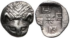CIMMERIAN BOSPOROS, Pantikapaion. Circa 420-410 BC. AR Tetartemorion (6mm, 0.14 g). Facing head of lion / Quadripartite incuse square with windmill/swastika pattern with central star, ethnic in quarte