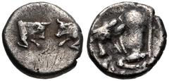 Greek CARIA, Uncertain ('Mint D'). Circa 450-400 BC. AR Tetartemorion (6.5mm, 0.33 g, 7h). Confronted foreparts of two bulls / Forepart of bull left; star(?) below. SNG Ashmolean 336; SNG Keckman 913–