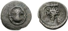 BOIOTIA, Federal Coinage. Circa 395-340 BC. AR Tetartemorion (0.20 g). Boiotian shield / Grape bunch on vine; above, club right (engraved in die over vine); B to left; all within incuse circle. VF, ev