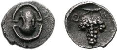 BOIOTIA, Thebes. Circa 405-395 BC. AR Tetartemorion (0.25 g). Boiotian shield / Grape bunch on vine; Q-H across upper field; all within incuse concave circle. Bérend, Réflexions 36 (this coin). Superb