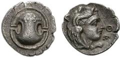 BOIOTIA, Thebes. Circa 395-338 BC. AR Obol (0.80 g). Theot(i)-, magistrate. Struck circa 363-348 BC. Boiotian shield, [club left across upper half] / Youthful head of Herakles right, wearing lion's sk