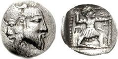 PHILISTO-ARABIAN. Gaza. Circa 375-333 BC. AR Tetartemorion (0.19 g, 8h). Janiform head of Silenos on left, satyr on right / Slinger in throwing stance right; E to left, triskeles to right; all within 
