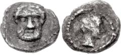 Greek SAMARIA. Circa 375-333 BC. AR Tetartemorion (5mm, 0.11 g, 1h). Facing bearded head / Head of female right. Meshorer & Qedar 194; HGC 10, –. Near VF, toned.