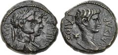Roman Provincial LYDIA, Philadelphia. Gaius (Caligula). AD 37-41. Æ (18mm, 4.54 g, 12h). Melanthos, priest of Germanicus. Bare head right; six-rayed star behind / Laureate and draped busts of the Dios