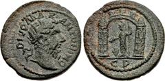 Roman Provincial MACEDON, Philippi. Divus Marcus Aurelius. Died AD 180. Æ (24mm, 9.52 g, 6h). Struck under Gallienus, AD 260-268. Radiate head of Divus Marcus Aurelius right / Two towers with curved, 
