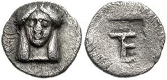 IONIA, Kolophon. Circa 450-410 BC. AR Tetartemorion (7mm, 0.25 g). Facing head of Apollo / TE (tetartemorion) monogram in incuse square. Milne, Colophon 7; SNG Kayhan 356; SNG von Aulock 1999; Rosen 5