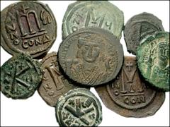 BYZANTINE. Lot of nine Byzantine Æ of Tiberius II and Maurice. Tiberius II. Æ Follis. Constantinople mint. RY 7. SB 430 // Maurice. Æ Follis. Constantinople mint. RY 13. Struck on cut-down follis of J