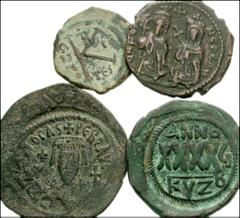 BYZANTINE. Lot of four Byzantine Æ of Phocas. Æ Half Follis. Thessalonica mint. RY 1. SB 654 // Æ Follis. Cyzicus mint. RY 6. Overstruck on follis of Justin II. SB 665 // Æ Follis. Cyzicus mint. RY 6.