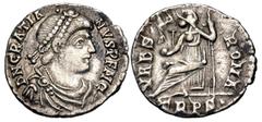 Roman Imperial Gratian. AD 367-383. AR Siliqua (17mm, 1.79 g, 6h). Treveri (Trier) mint. Struck AD 367-375. Pearl-diademed, draped, and cuirassed bust right / Roma seated left on throne, holding Victo