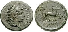 LYDIA, Tralles. Augustus. 27 BC-AD 14. Æ 22mm (7.86 g, 12h). Nicomedes, magistrate. KAISAREWN, radiate head of Helios right / NIKO below horses, MHDHS in exergue, Nike, holding reins in left hand and 