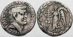 Estimate $400 MARK ANTONY. 31 BC. AR Denarius (3.54 gm). Mint moving with Mark Antony. Bare head of Antony right / Victory standing left, holding a wreath tied with a fillet in right hand, palm in lef
