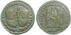 Licinius I, with Licinius II. AD 308-324. Æ Follis (3.34 g, 12h). Nicomedia mint, 3rd officina. Struck AD 318. Confronted laureate and draped busts of Licinius I and II, jointly holding small figure o