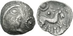 CELTIC, Iceni. Uninscribed. Circa 65-1 BC. AR Unit (1.19 g, 3h). Large Flan C (Early Face-Horse Cc) type. Struck circa 50-30 BC. Celticized head right; solar ‘anemone’ to right / Celticized horse spri