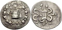 LYDIA, Tralleis. Circa 166-67 BC. AR Tetradrachm (28mm, 12.55 g, 12h). Cistophoric type. Struck 166-160 BC. Cista mystica with serpent; all within ivy wreath / Bow-case with serpents; to right, forepa