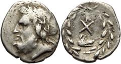 ACHAIA, Achaian League. Argos . Circa 195-188 BC. AR Hemidrachm (15mm, 2.40 g, 12h). Laureate head of Zeus left / Monogram of the Achaian League; above, TK monogram; below, wolf’s head right; all with