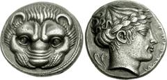 BRUTTIUM, Rhegion. Circa 415/0-387 BC. AR Tetradrachm (16.46 g, 9h). Facing lion’s head / Head of Apollo right, wearing laurel wreath; olive sprig behind, PHΓINON before. Herzfelder 75 (D43/R63); HN I