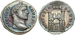 Diocletian. AD 284-305. AR Argenteus (3.32 g, 12h). Ticinum mint. Struck circa AD 294. DIOCLETI ANVS AVG, laureate head right / VICTORIA SARMAT, four tetrarchs sacrificing over tripod before city encl